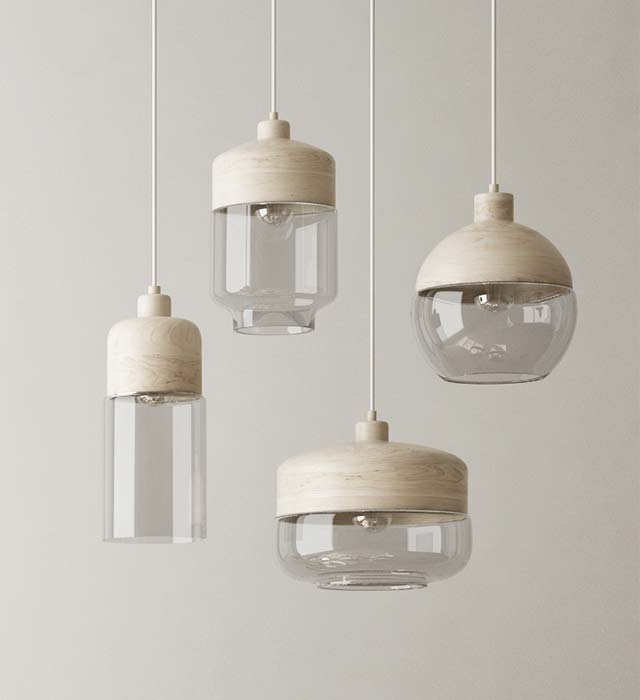 A group of four hanging lights with clear glass.