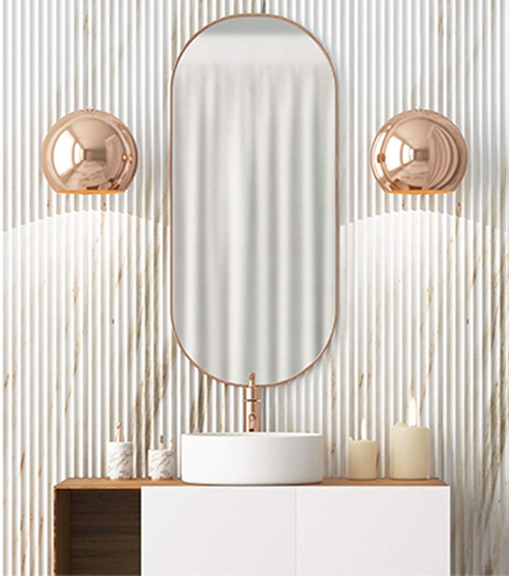 A bathroom with two candles and a mirror