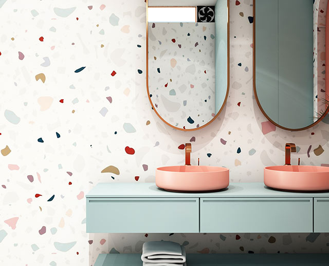 A bathroom with two sinks and mirrors on the wall