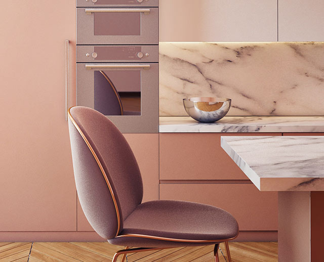 A chair in the middle of a kitchen with pink walls.