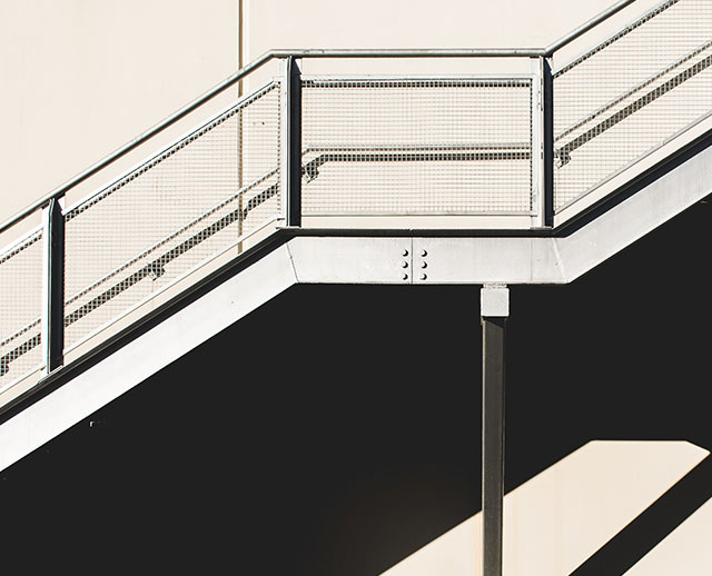 A metal railing on the side of a building.