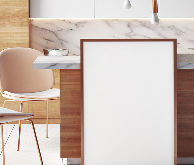 A white sign sitting in front of a kitchen counter.