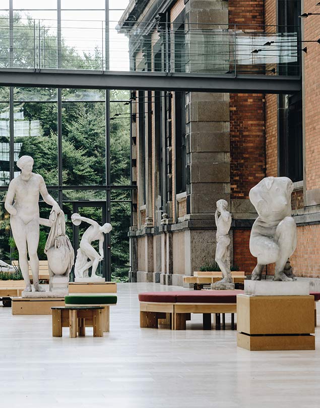 A group of statues in front of a building.